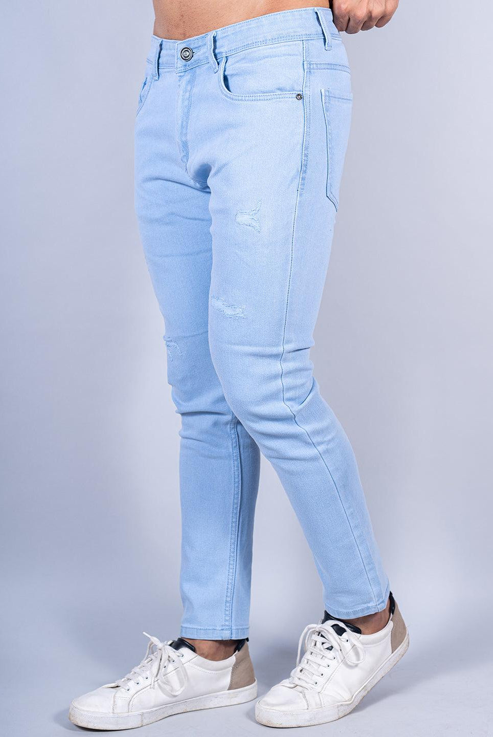 light blue distressed loose ankle mens jeans