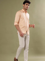 peach color shirt