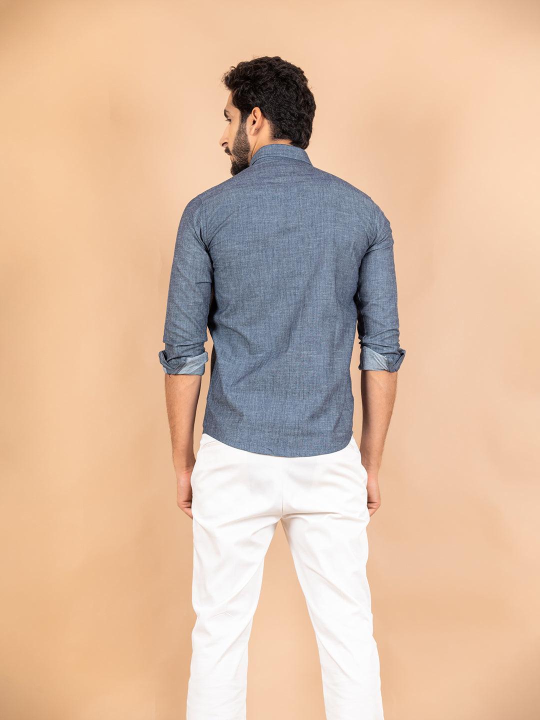 A cute boy by the white wall, grey shirt, blues jeans full size 3107011  Stock Photo at Vecteezy